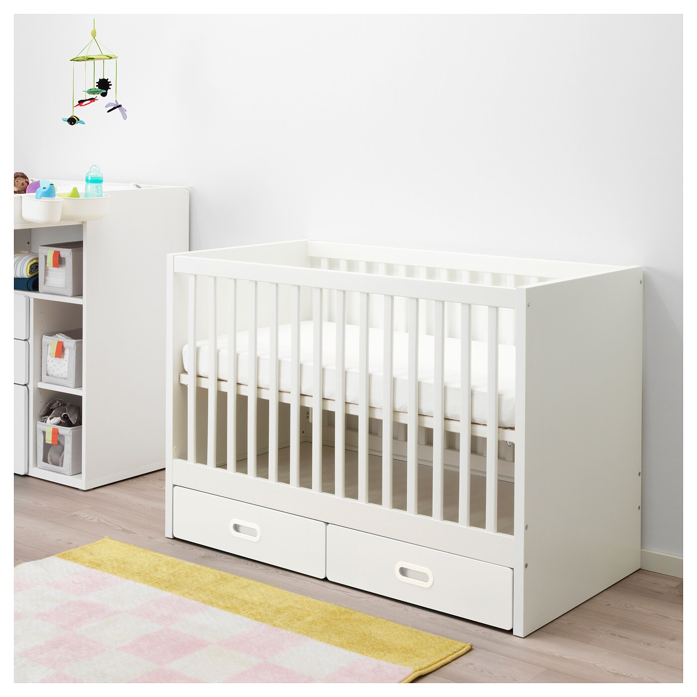 white cot with storage