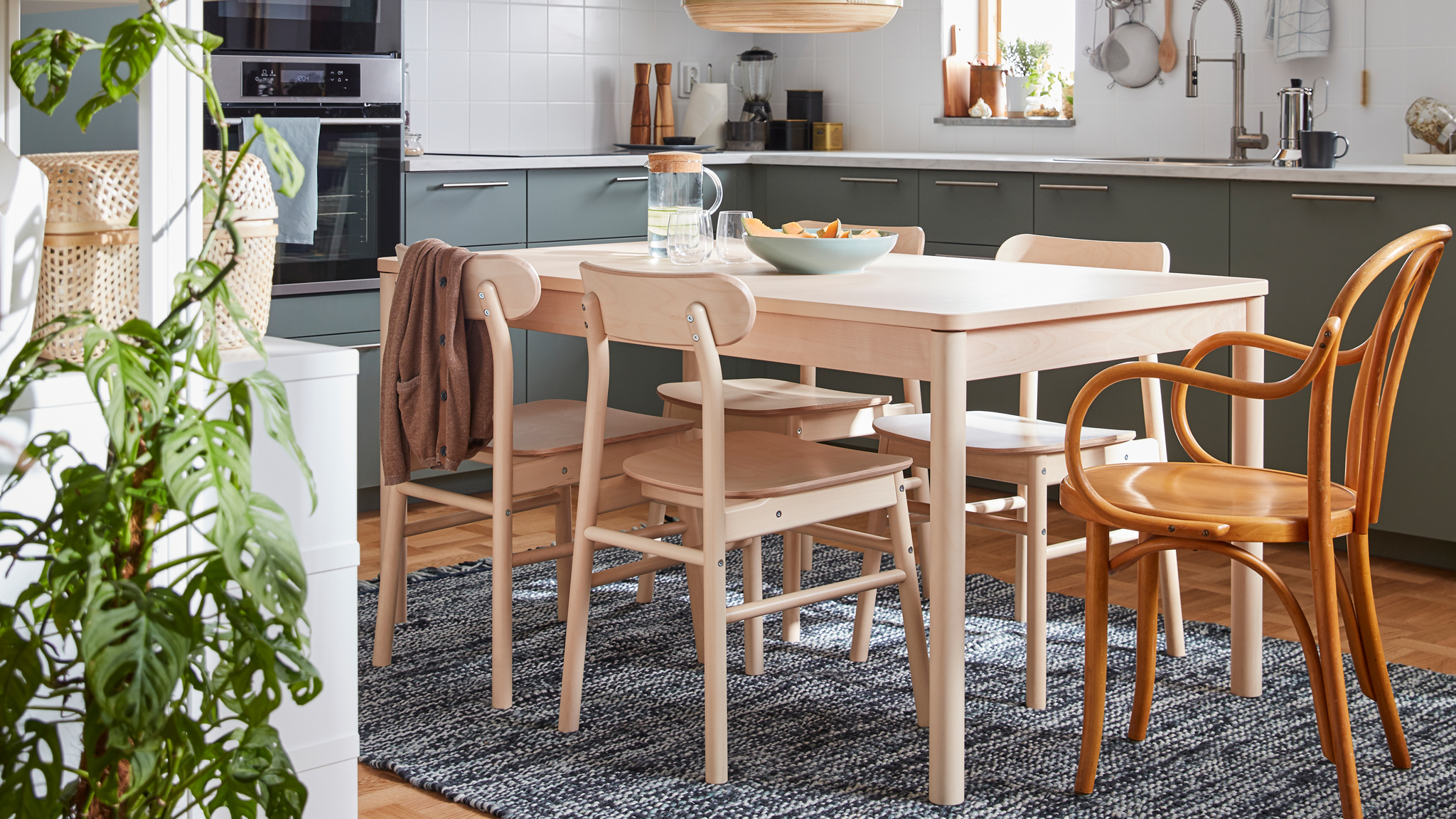 A birch wood dinner table and four chairs from the RÖNNINGE series, plus an IKEA chair from the 60’s.