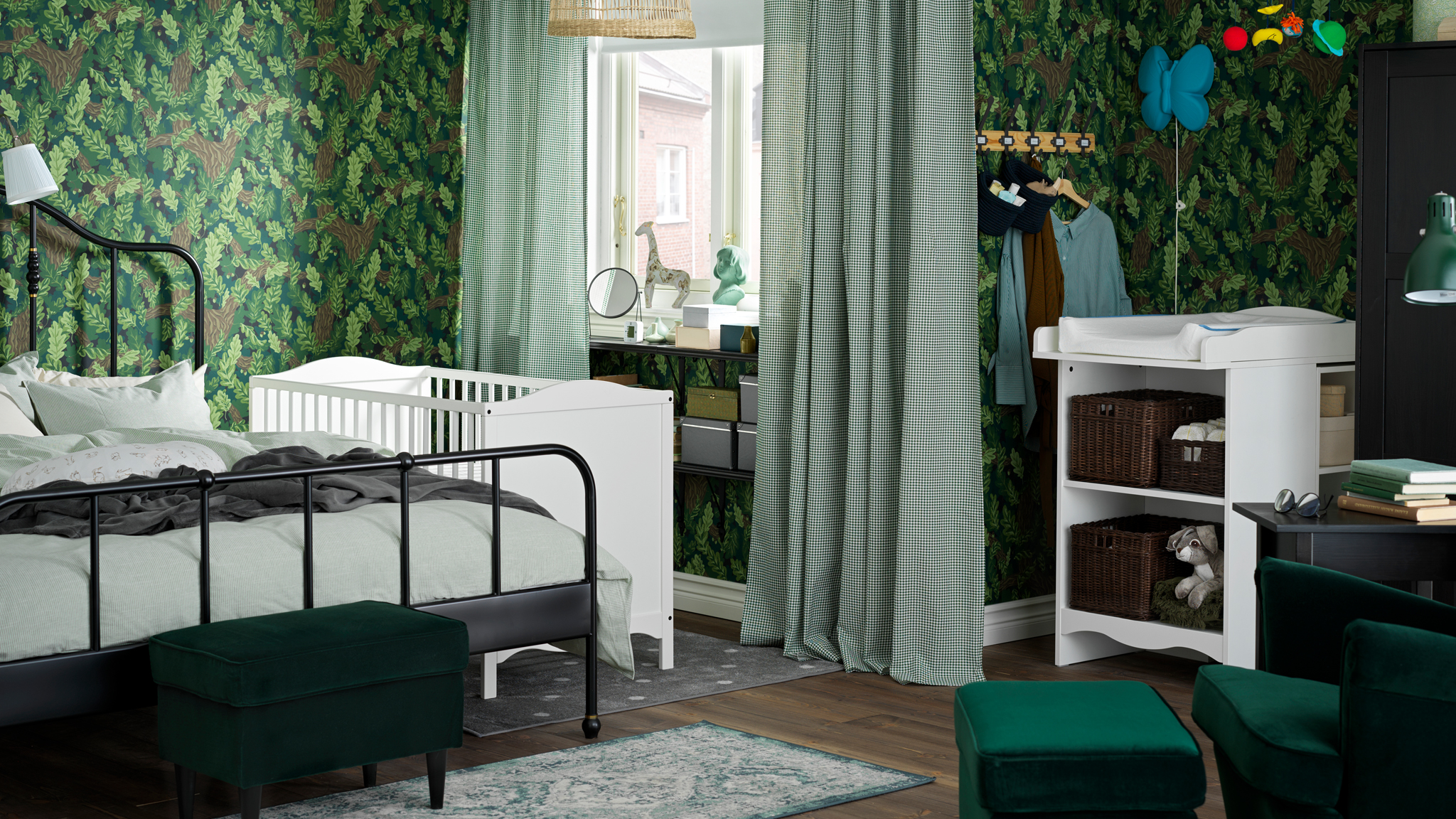 A family bedroom where a SAGSTUA double bed stands beside a white SMÅGÖRA cot and near a SMÅGÖRA changing table.