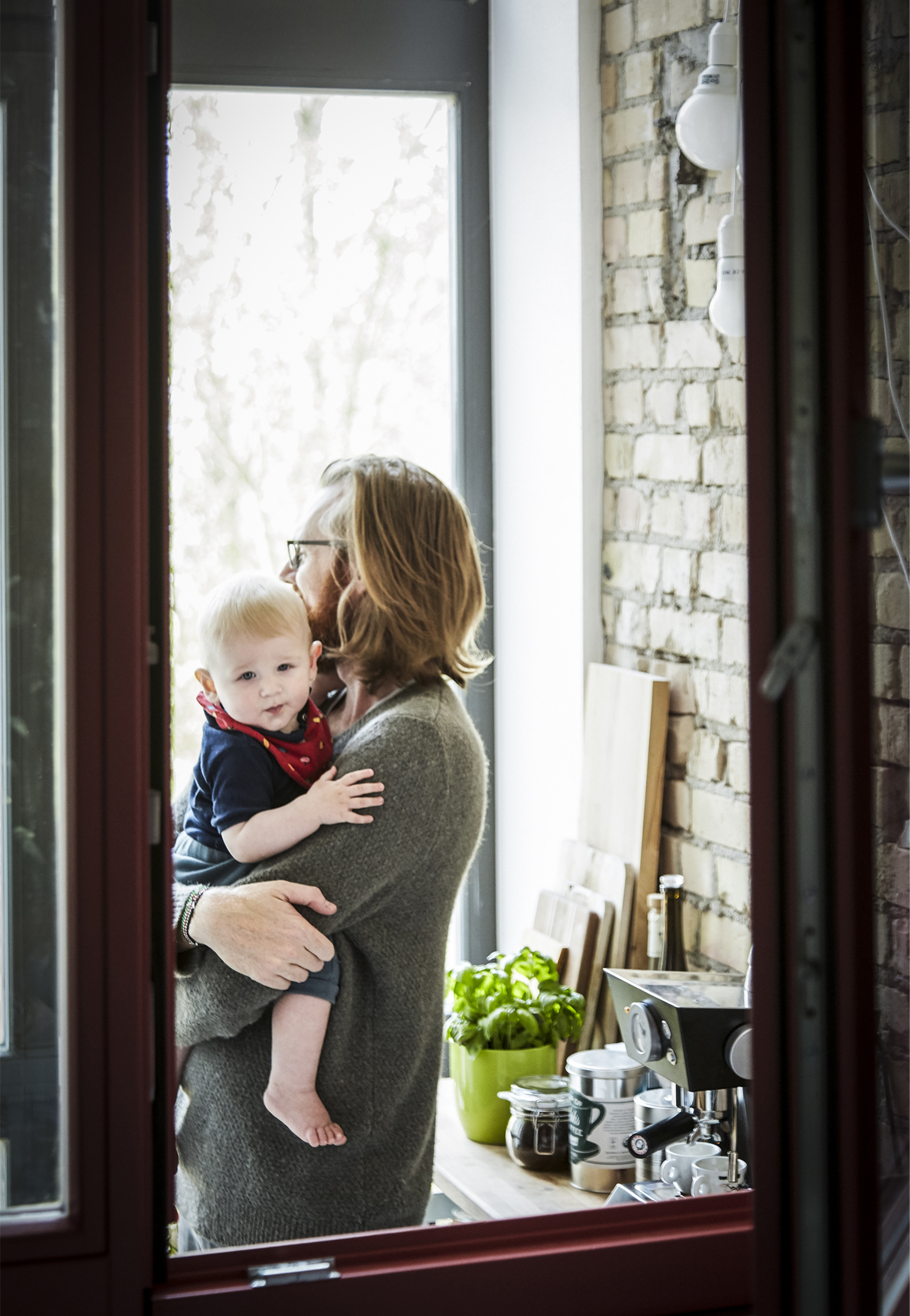 A portrait of Adam and son Louie.