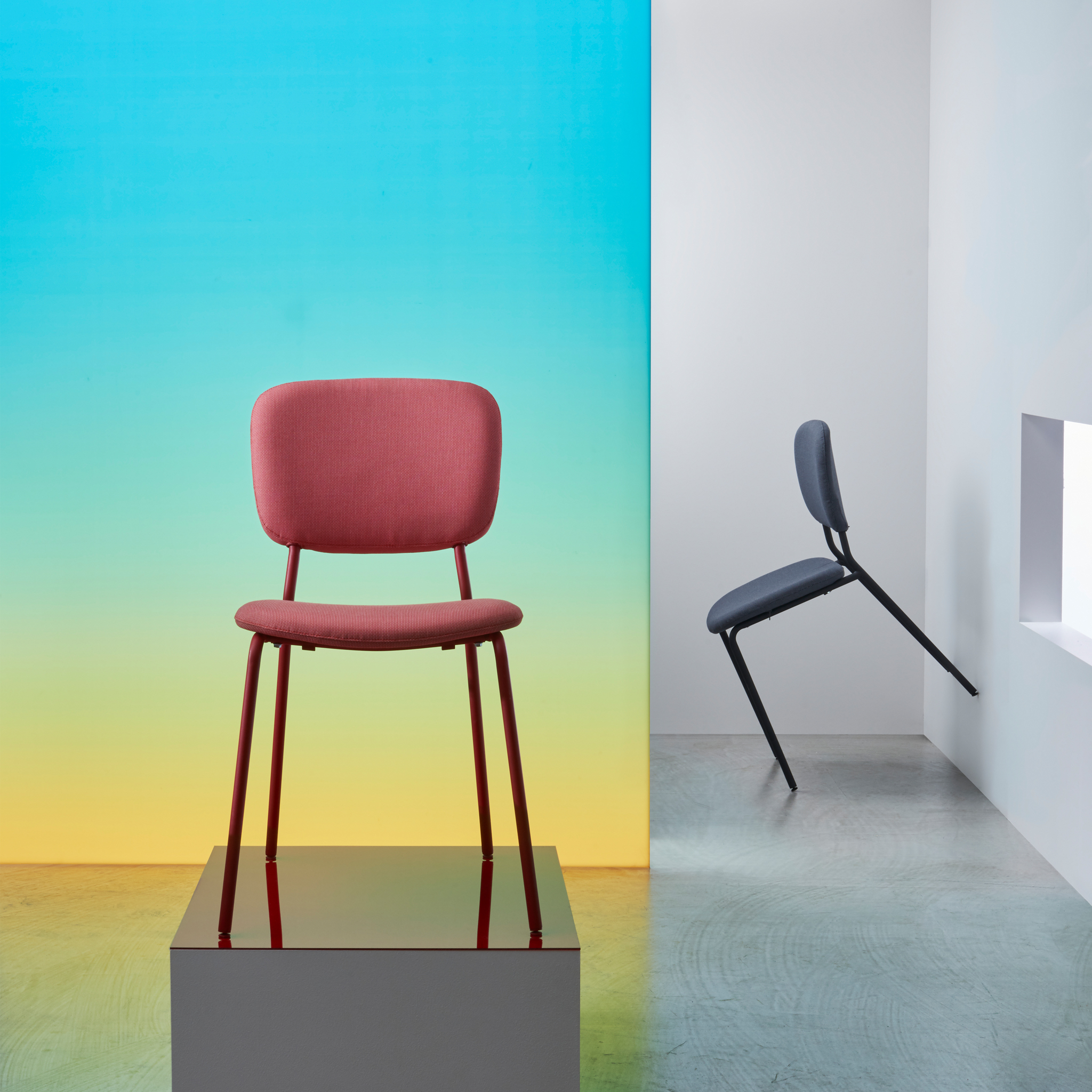 A red KARLJAN chair with an upholstered seat and backrest on a metal frame with a retro-inspired design.