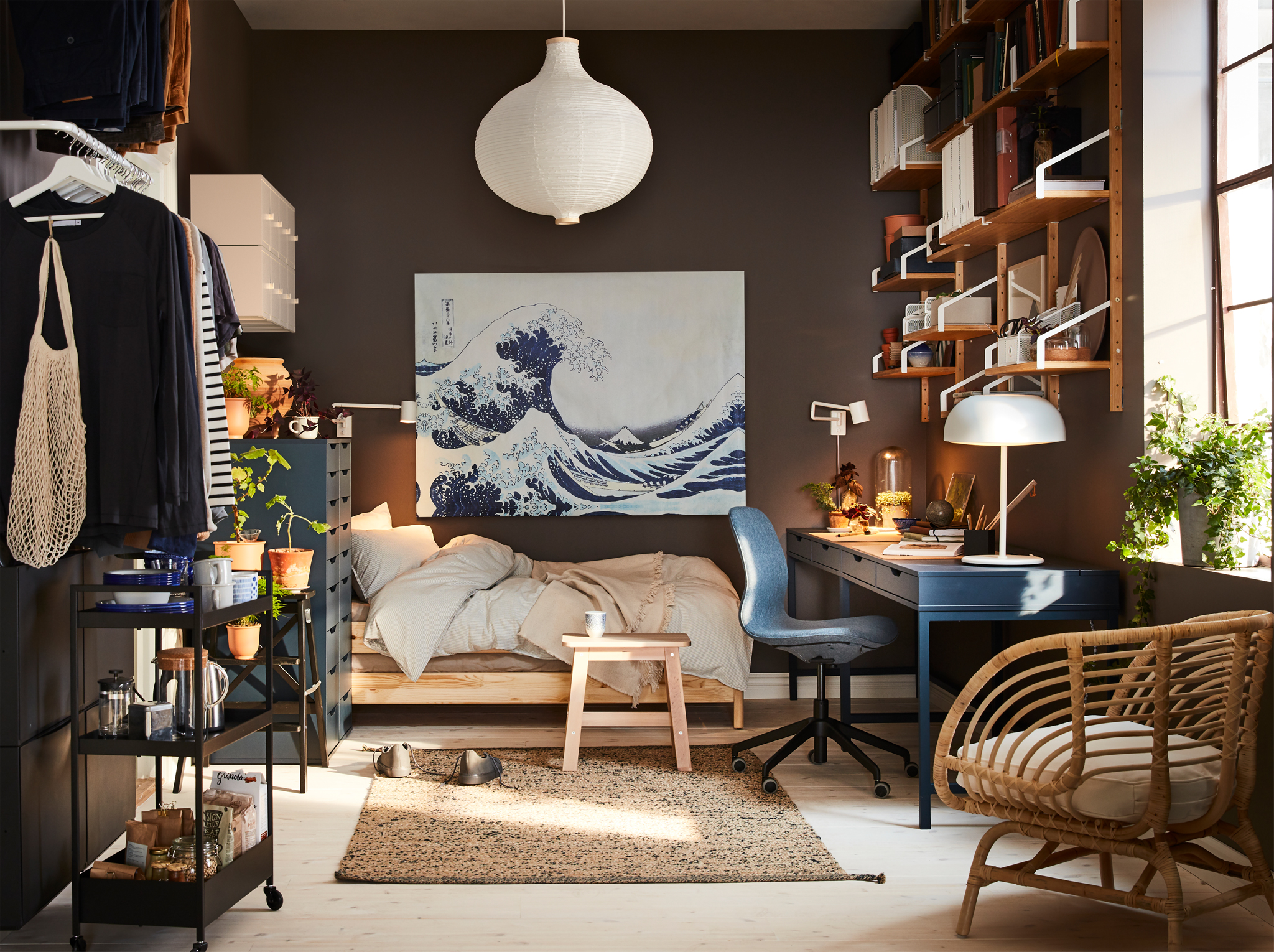 A Small Home With A Dark Blue Desk A Rattan Armchair A White Ad91e54fb27ef81c80dd7be Jpg