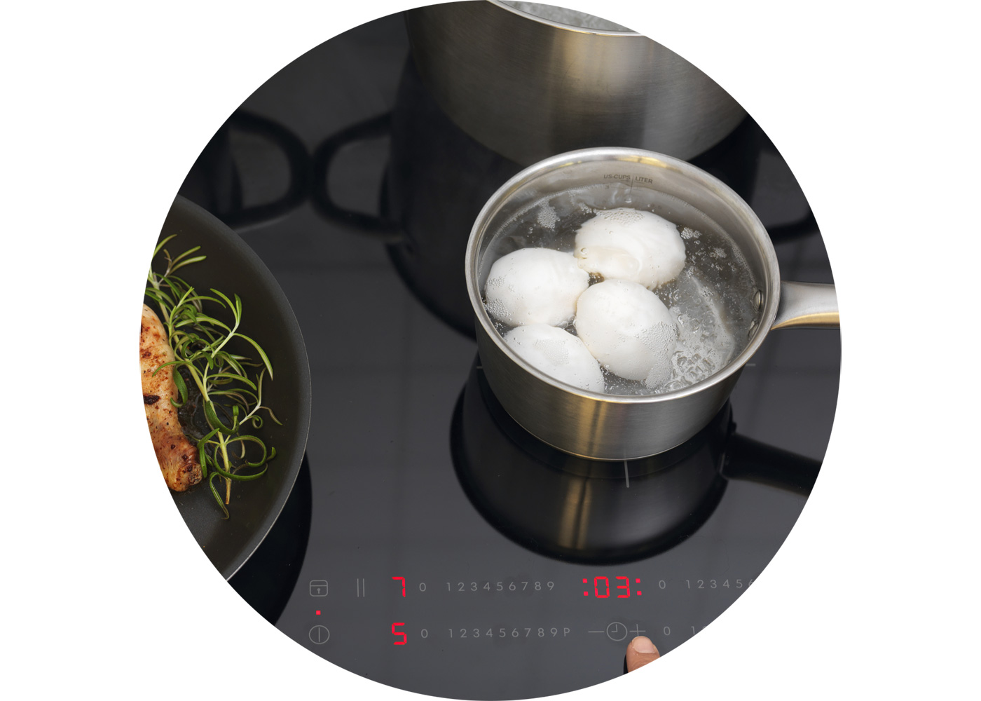 An IKEA Induction hob with an IKEA pot where eggs are boiling.