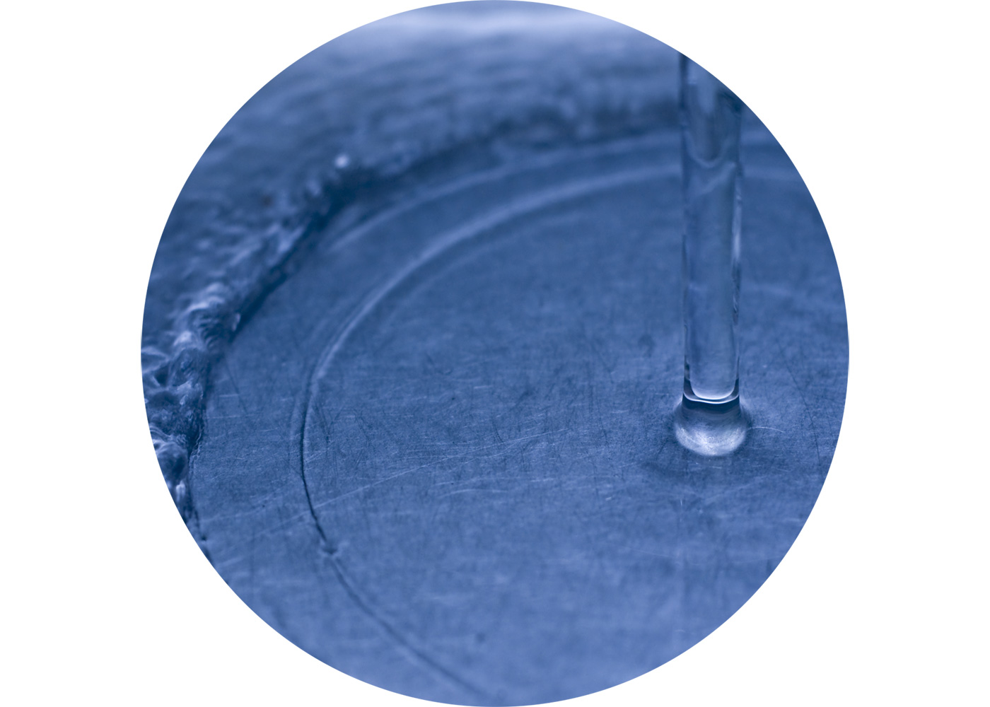 Close up of flowing water meeting a surface.
