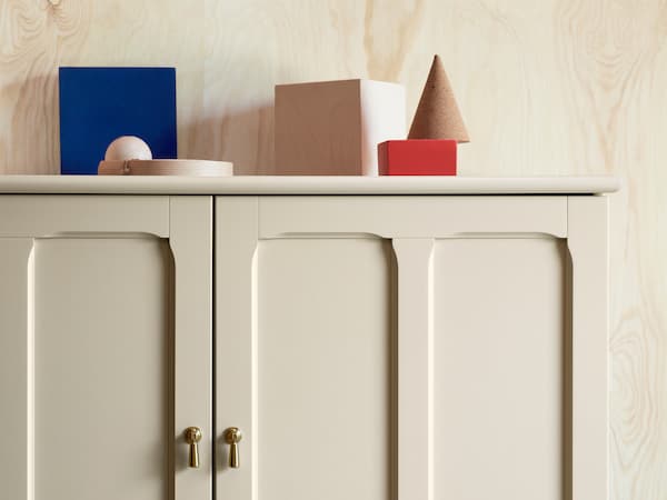 LOMMARP cabinet in beige with finely crafted details and drop handles for traditional-looking storage.
