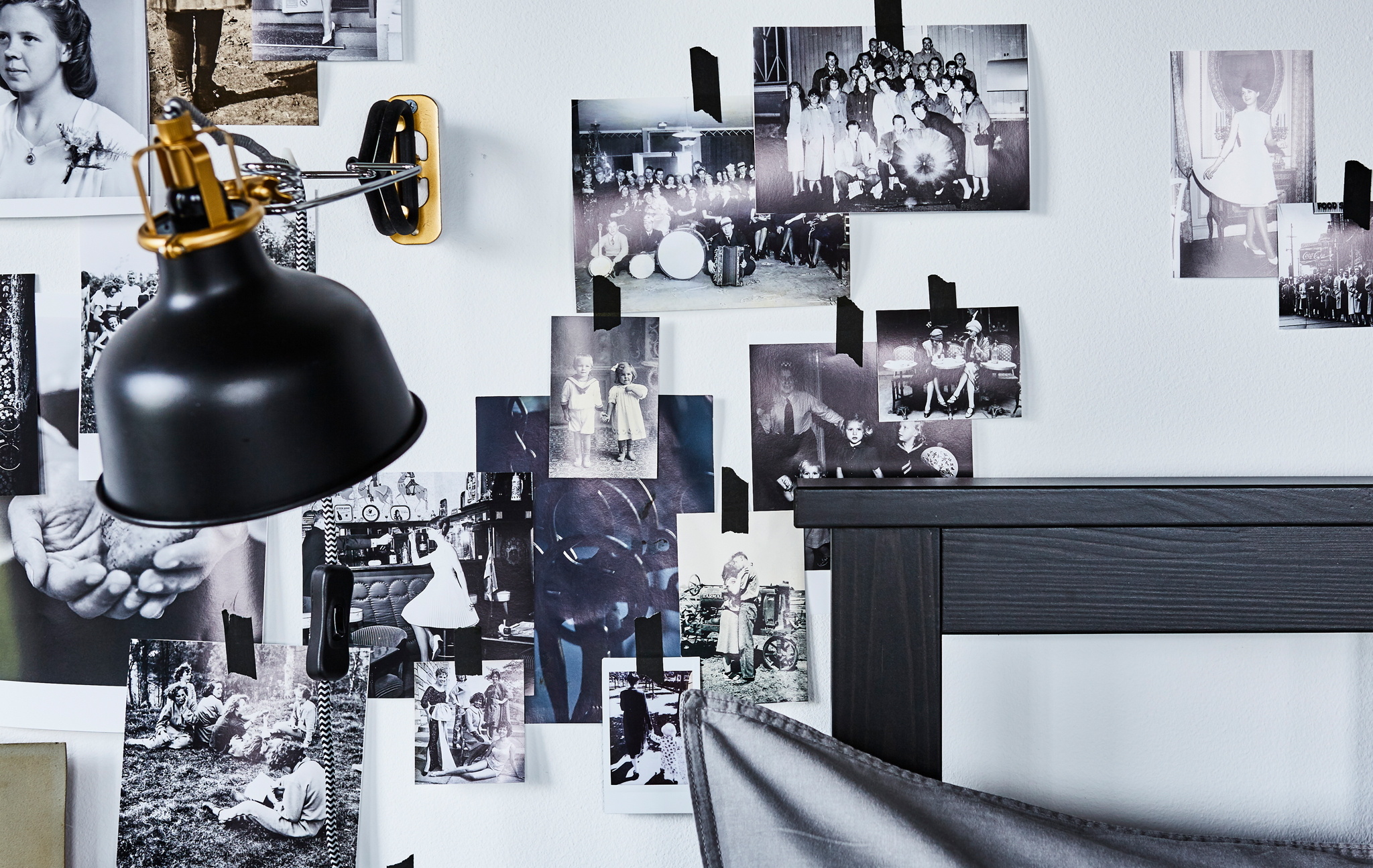Looking for small bedroom ideas? Beautify your bed frame with a photo wall collage. Shine some light at it with a lamp such as IKEA RANARP N wall/clamp spotlight in black. You can easily aim the light where you need it as the lamp head is adjustable.