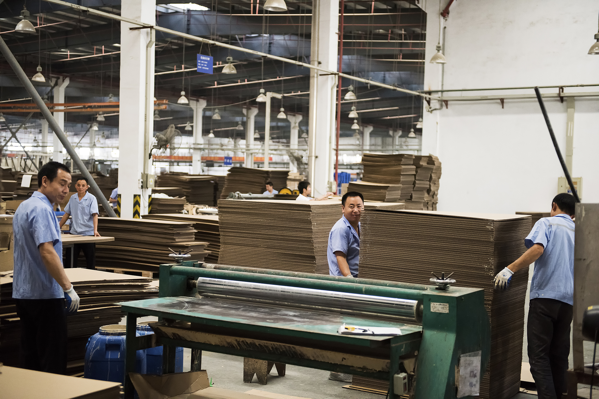 Men working inside an IKEA supplier factory.