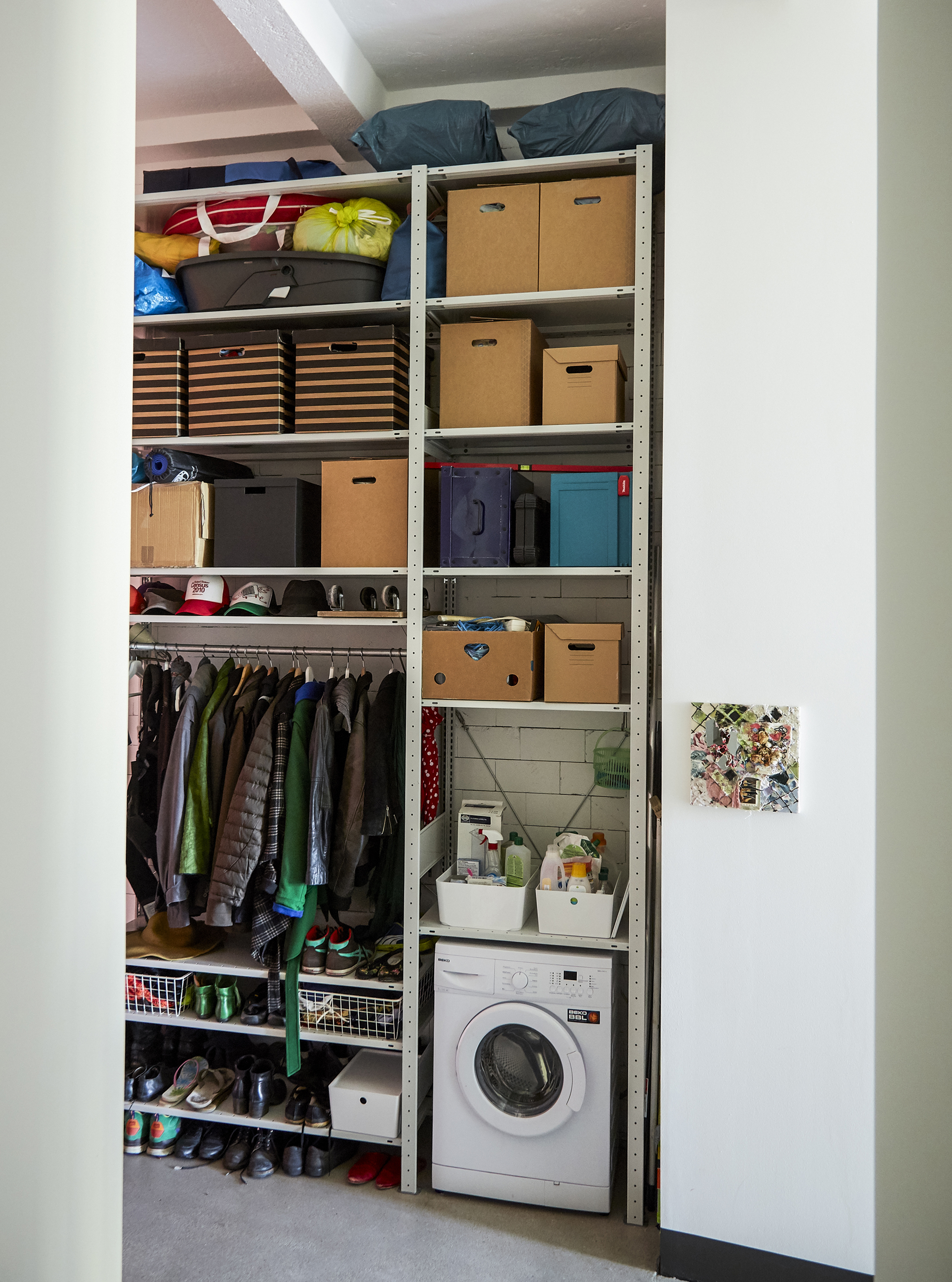 Open storage unit filling a whole wall.