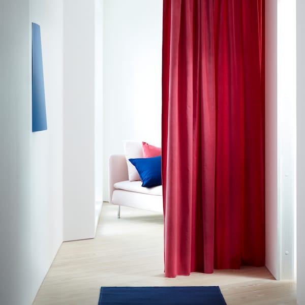 SANELA room darkening curtains made in cotton velvet in a lovely punch of light-brown red, here being used as a room divider.