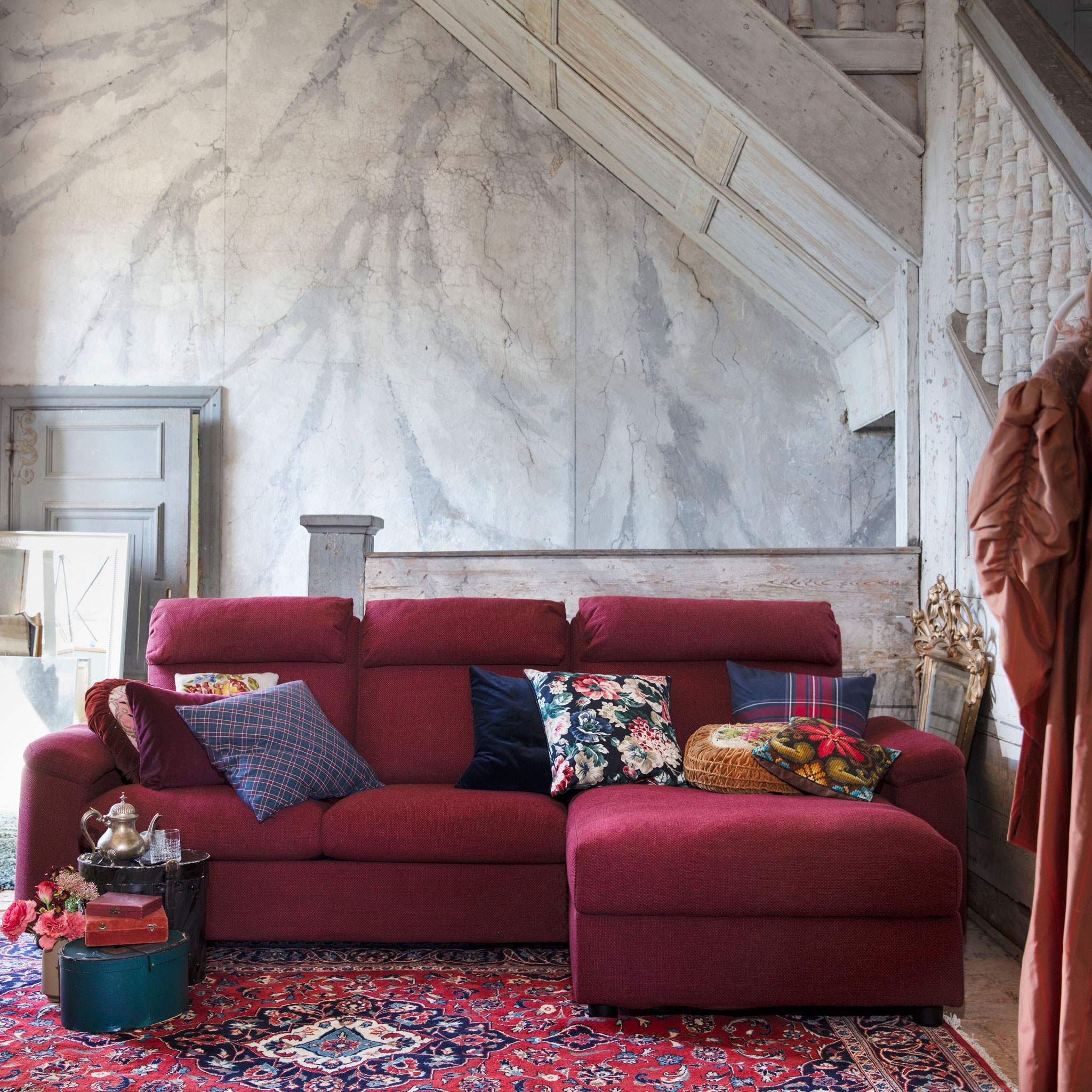 Sink into LIDHULT sofa series from IKEA with high backs, neck support, soft armrests and lots of covers and combinations like this red brown three-seater with chaise longue.