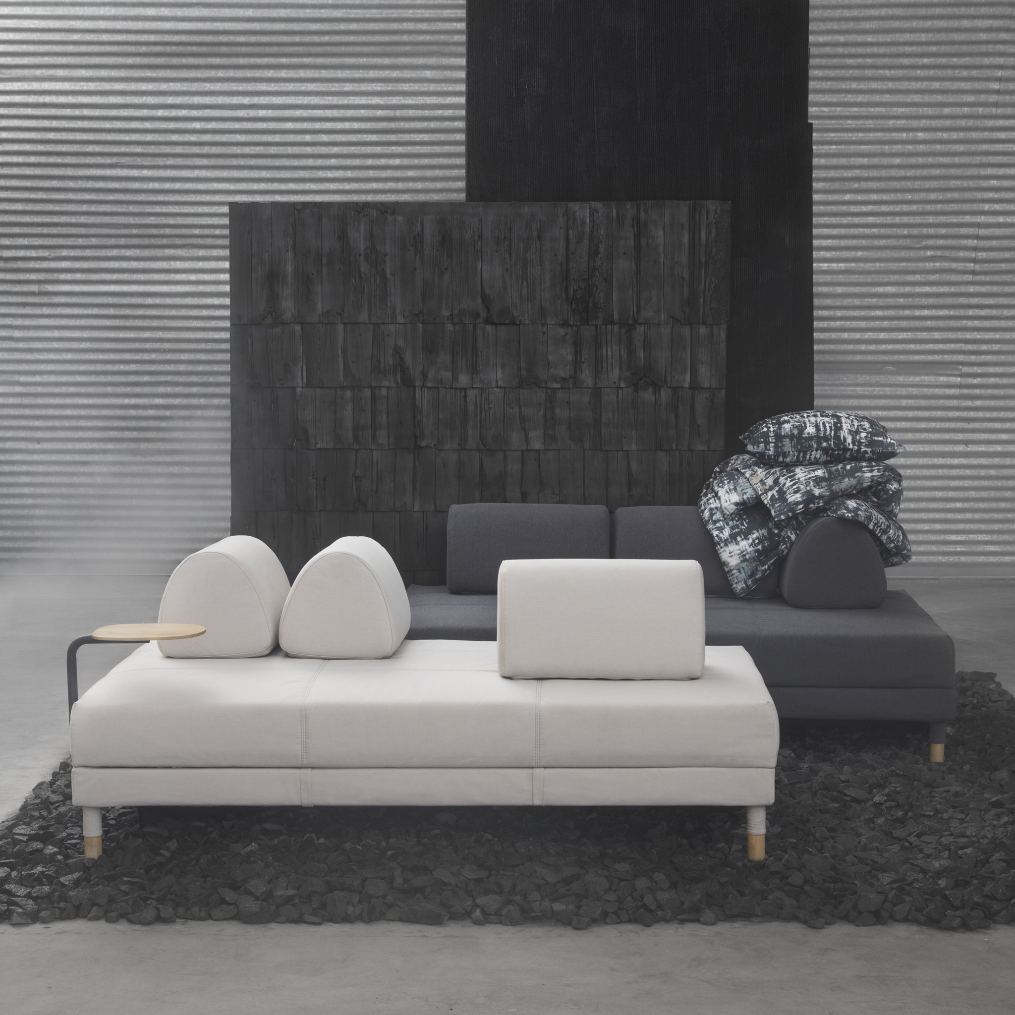 The cool, minimalist IKEA FLOTTEBO sofa-bed comes in beige, dark grey or green covers, you can even attach a small side table. The loose cushions of the sofa bed can be moved freely depending on how you want to sit or style the sofa.