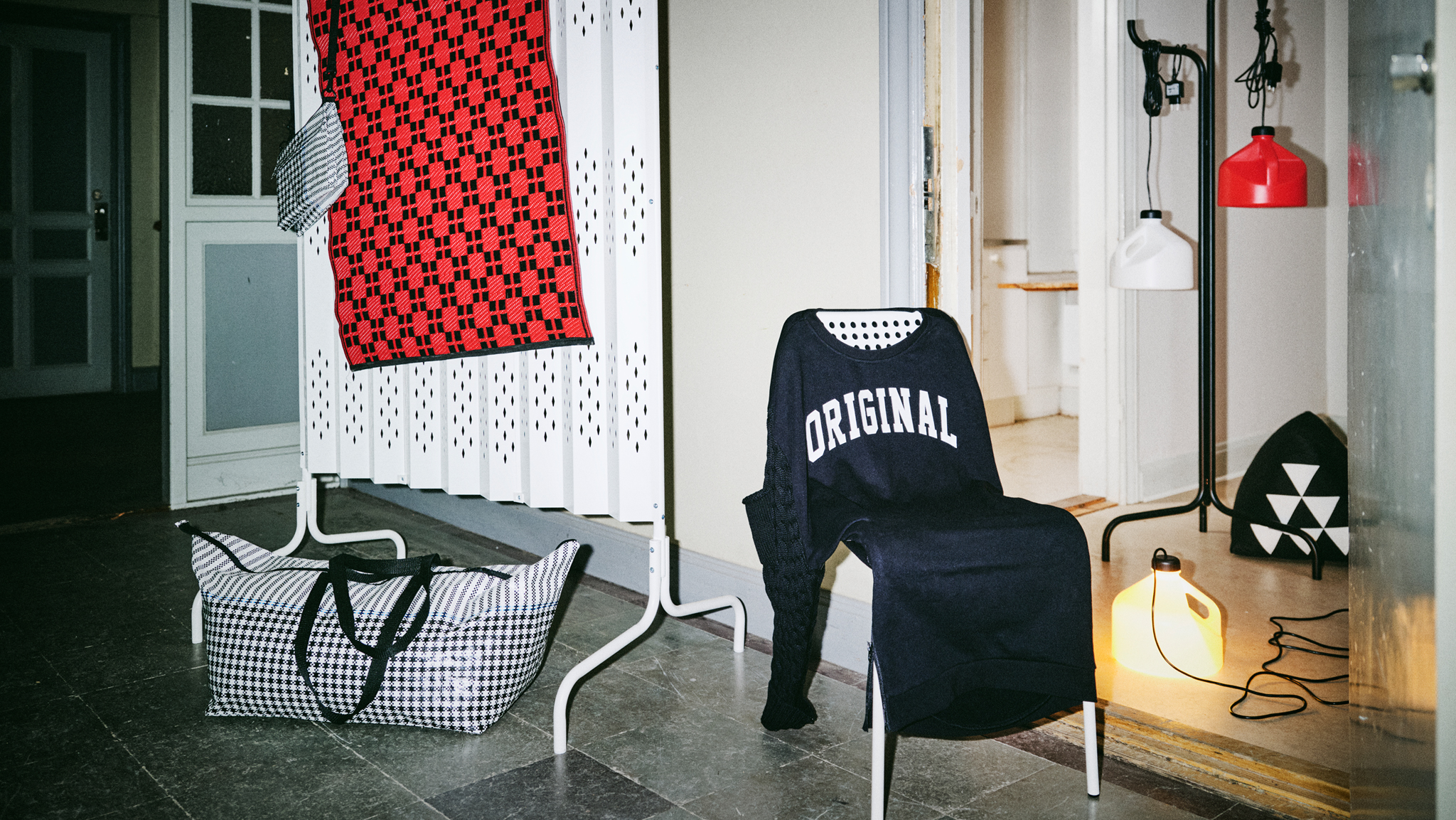 The SAMMANKOPPLA limited collection is displayed in a hallway lit only by the camera’s flash bulb and one of the string of lamps.