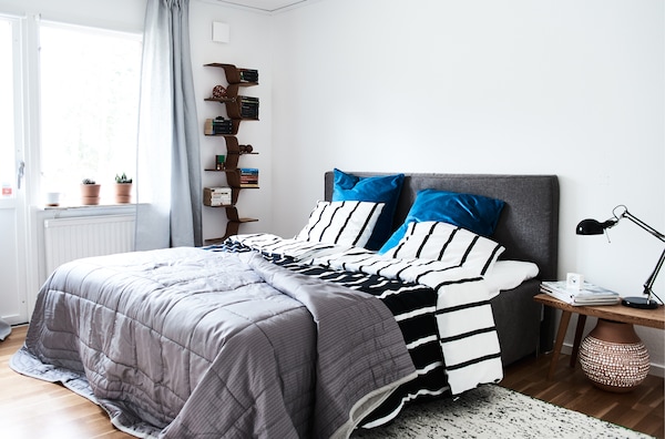 Use accent colours to add warmth to monochrome furnishings.
